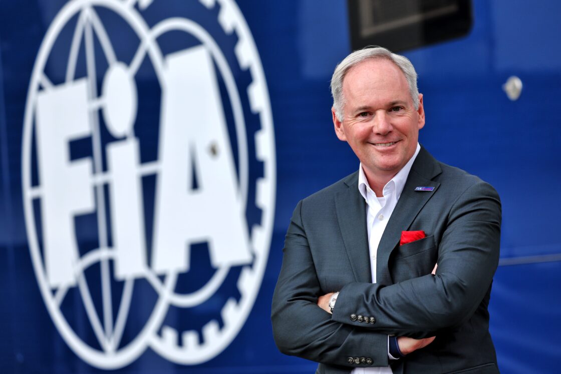 FIA Presidential Candidate Tim Mayer in front of an FIA backdrop