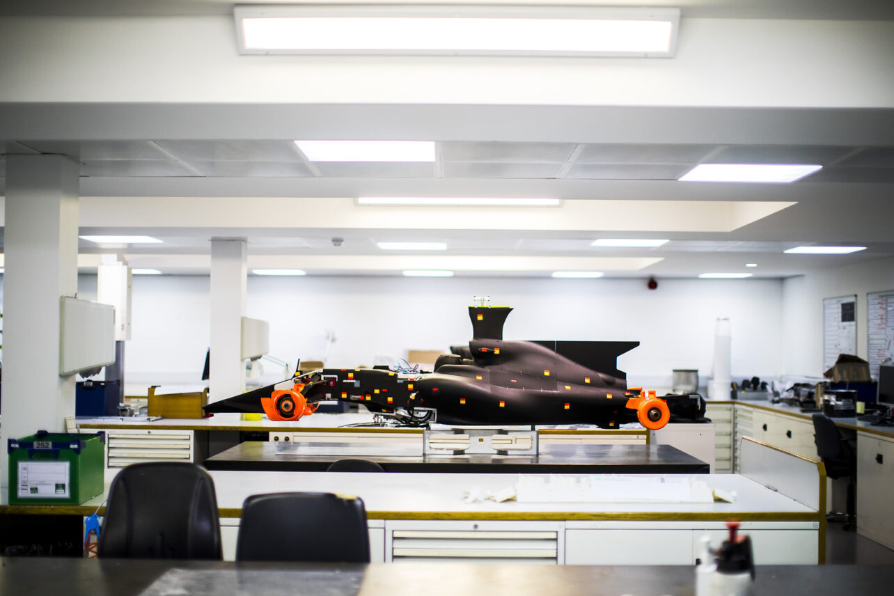 Scale model of an F1 car in the Mercedes Petronas Formula 1 Team race bays in Brackley
